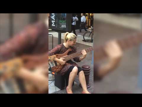 Girl street performer slams Bass like a pro